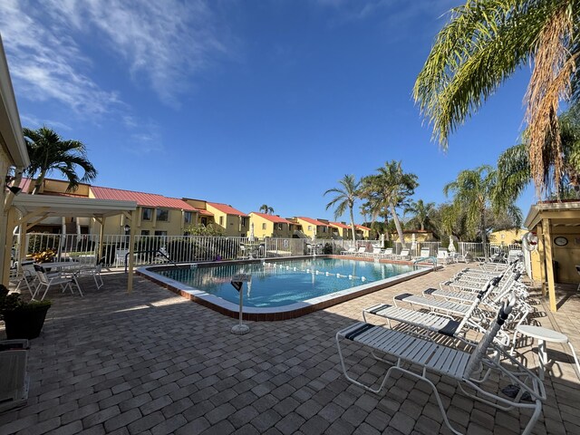 view of swimming pool featuring a patio area