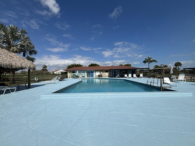 view of swimming pool with a patio area