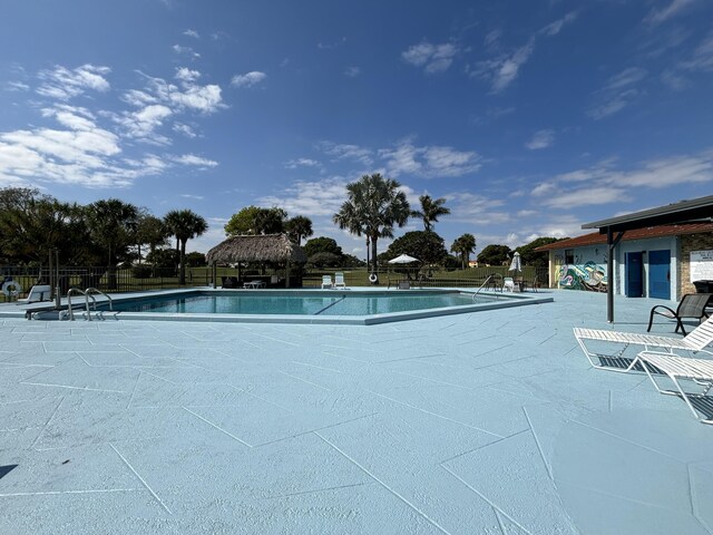 view of swimming pool featuring a patio area