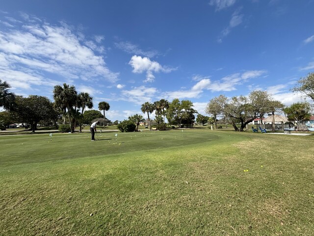 view of property's community with a yard