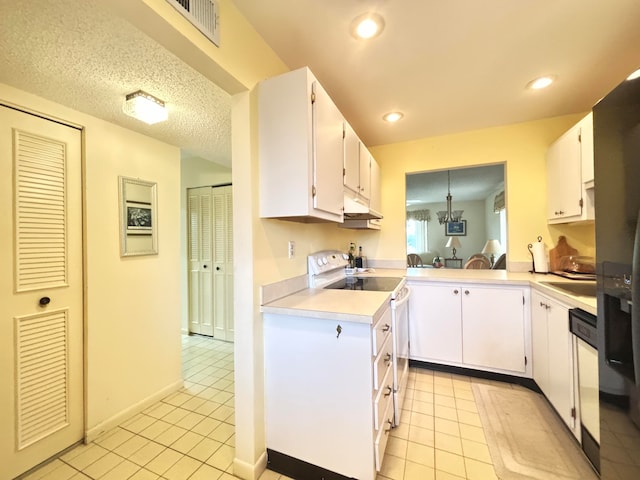 kitchen featuring white cabinetry, white range with electric stovetop, a textured ceiling, and light tile patterned floors