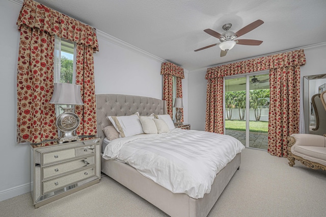 carpeted bedroom featuring access to outside, ceiling fan, and ornamental molding