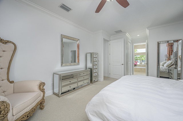 bedroom featuring ceiling fan, ornamental molding, light carpet, and connected bathroom