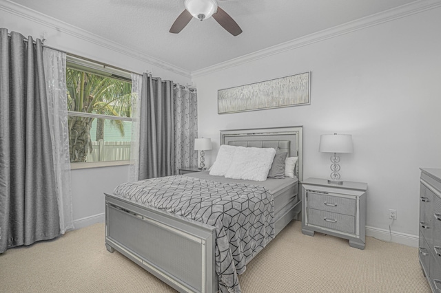 bedroom featuring ceiling fan, crown molding, and light carpet