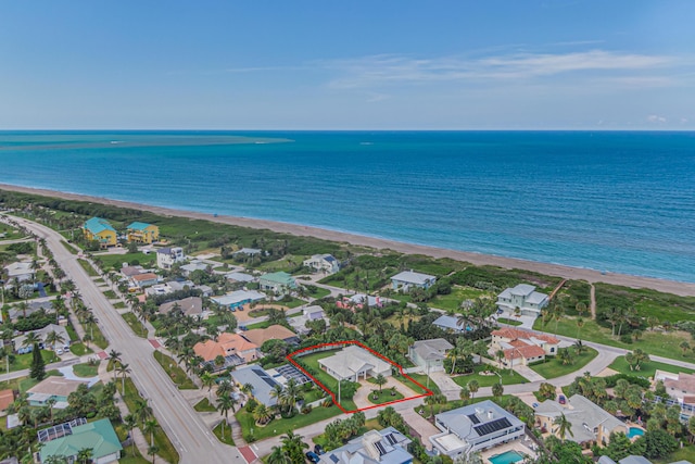 aerial view with a beach view and a water view