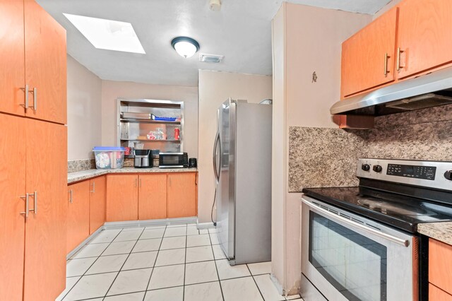 kitchen with light countertops, appliances with stainless steel finishes, visible vents, and under cabinet range hood