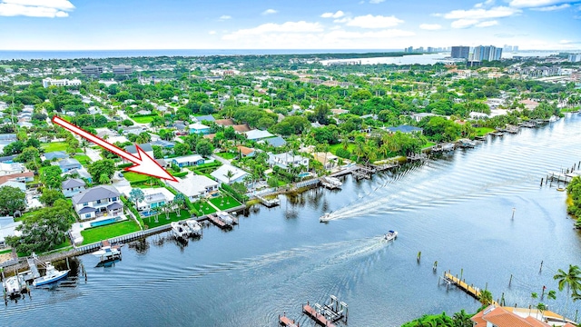 birds eye view of property with a water view