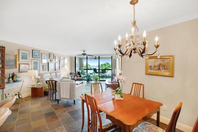 dining room featuring ceiling fan with notable chandelier, expansive windows, and crown molding