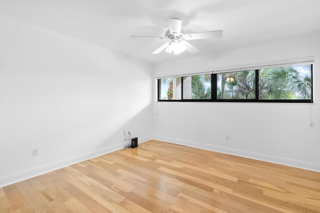 unfurnished room featuring light hardwood / wood-style floors and ceiling fan