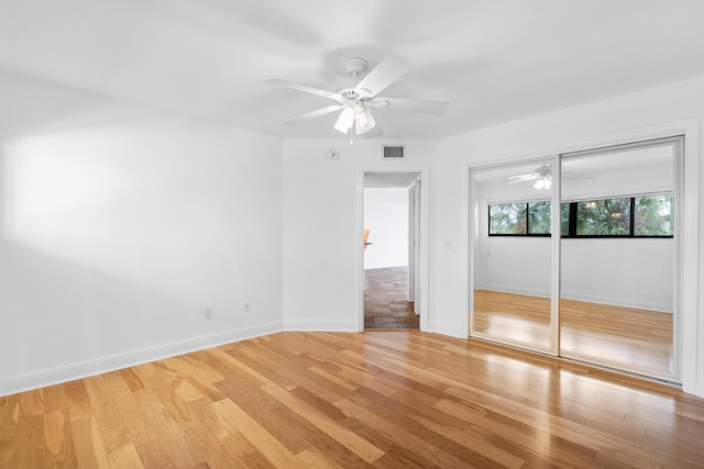 unfurnished room featuring ceiling fan and light hardwood / wood-style flooring