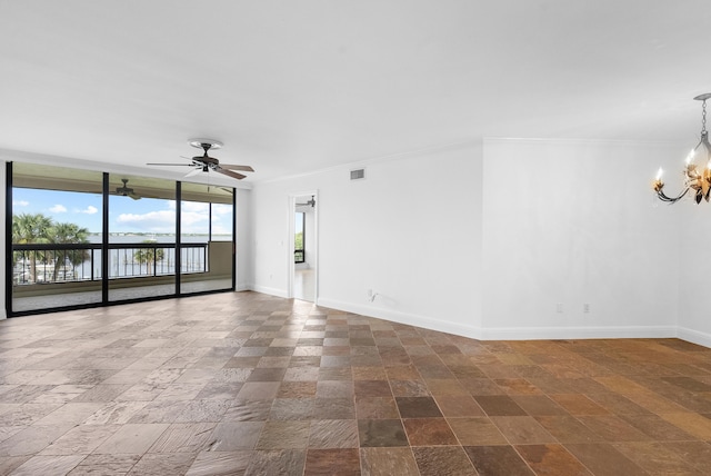 empty room with ceiling fan with notable chandelier, a water view, and ornamental molding