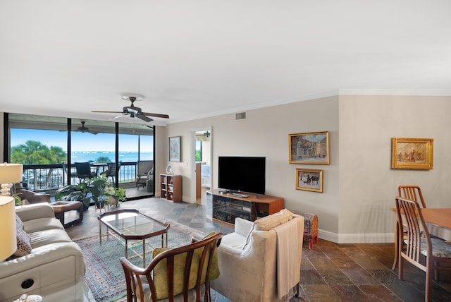 living room featuring ceiling fan, floor to ceiling windows, and ornamental molding