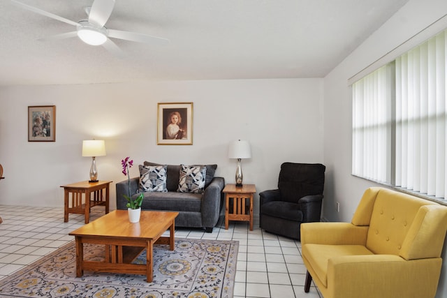 living room featuring ceiling fan and light tile patterned floors