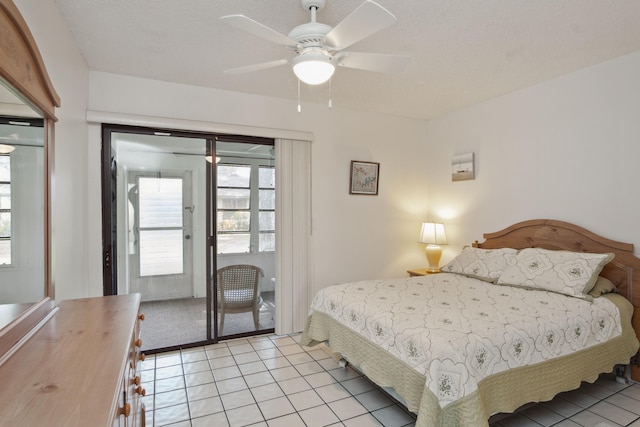 tiled bedroom with ceiling fan and access to outside