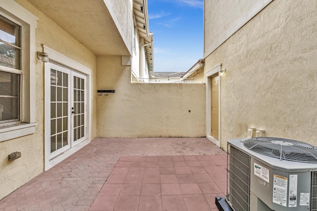 view of patio / terrace with french doors and central AC