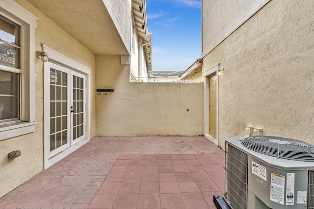 view of patio / terrace with cooling unit and french doors