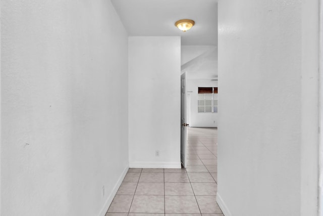 hallway featuring light tile patterned floors