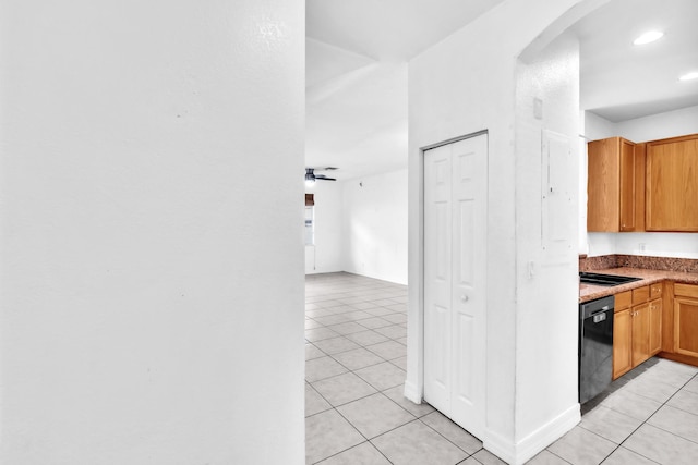 hall with light tile patterned floors