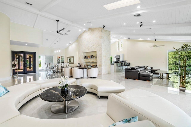 living room with plenty of natural light, high vaulted ceiling, beam ceiling, and ceiling fan