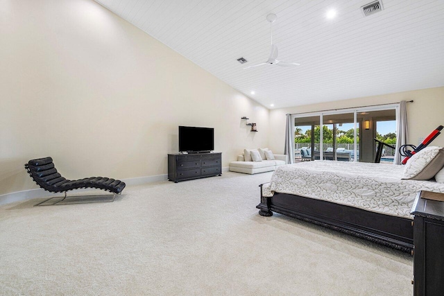 carpeted bedroom with access to outside and high vaulted ceiling