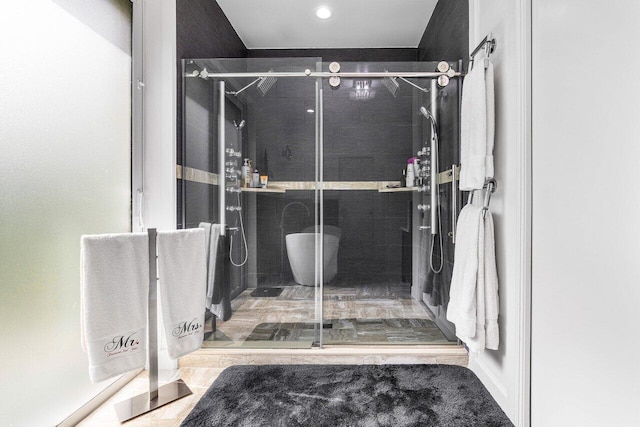 bathroom with a shower with shower door