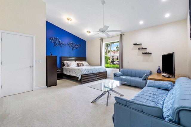 carpeted bedroom featuring ceiling fan and vaulted ceiling