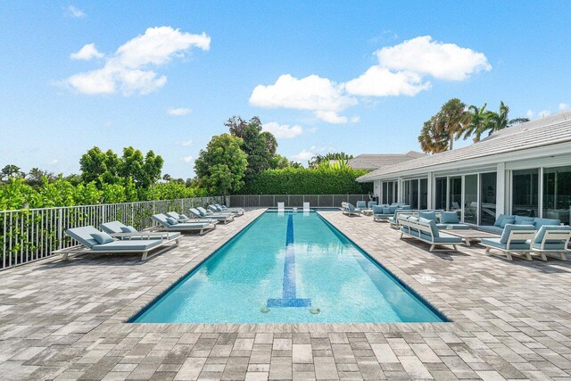 view of swimming pool with outdoor lounge area and a patio area