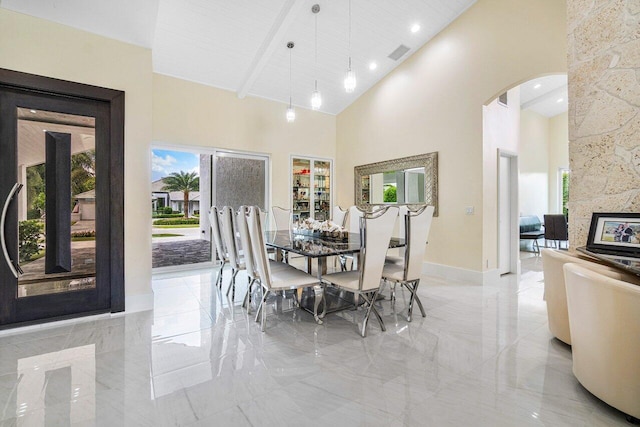 dining room with wood ceiling, high vaulted ceiling, and beam ceiling