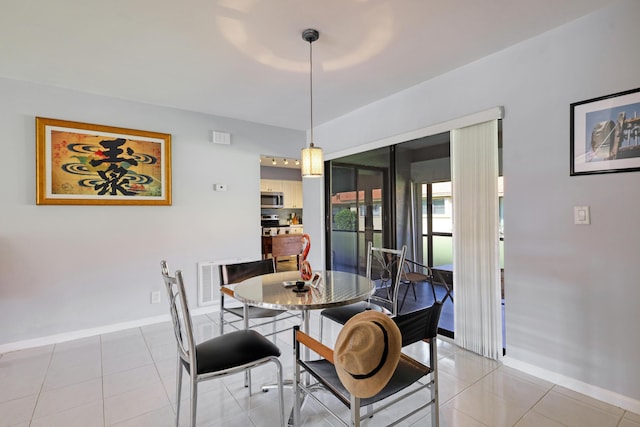 dining room featuring light tile patterned floors