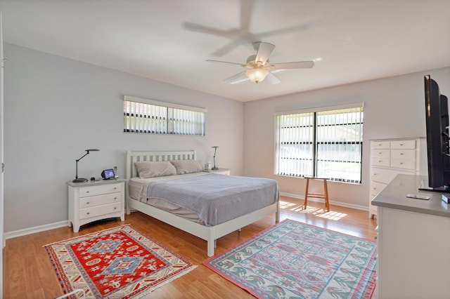 bedroom featuring ceiling fan and hardwood / wood-style flooring