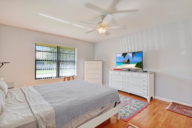 bedroom featuring light wood-type flooring and ceiling fan