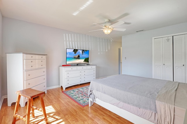 bedroom featuring light hardwood / wood-style flooring, a closet, and ceiling fan