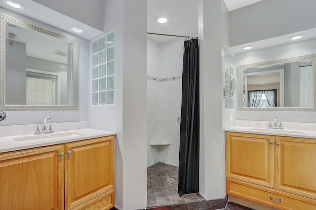 bathroom featuring a shower with curtain and vanity