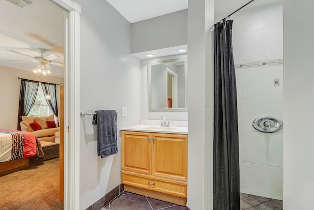 bathroom featuring vanity, ceiling fan, and tile patterned floors