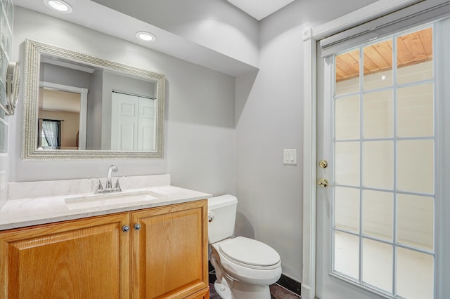 bathroom with vanity and toilet