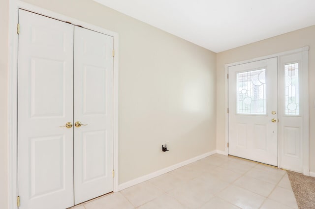 entrance foyer with light tile patterned flooring