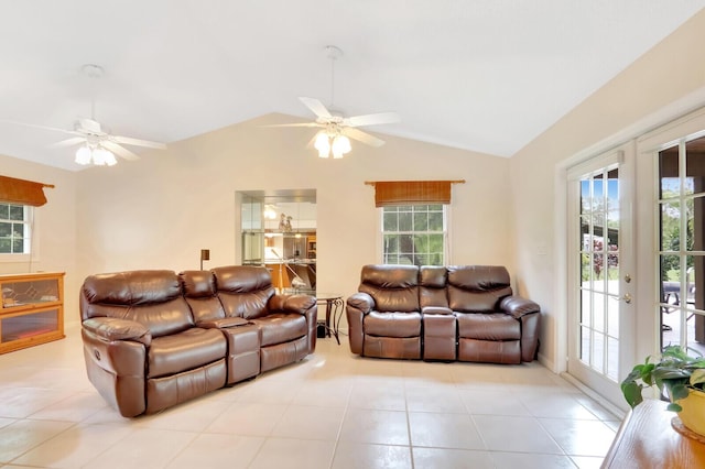 living area with a ceiling fan, lofted ceiling, and a healthy amount of sunlight