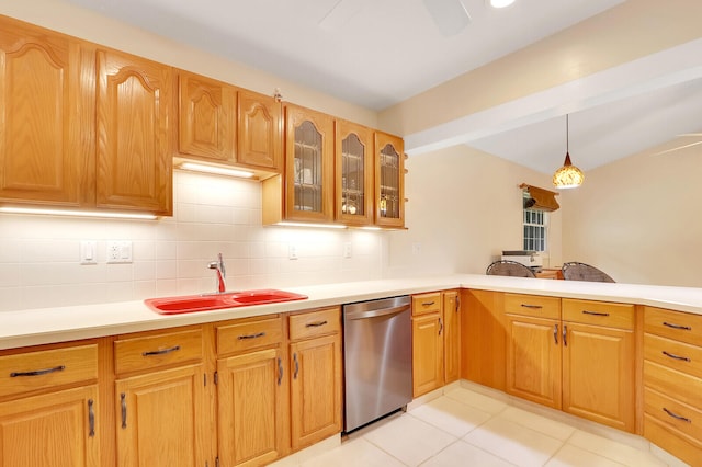 kitchen with sink, hanging light fixtures, backsplash, stainless steel dishwasher, and light tile patterned flooring