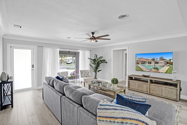 living room featuring ceiling fan and light hardwood / wood-style floors