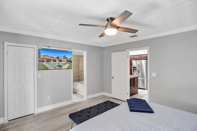 bedroom featuring refrigerator, ornamental molding, ensuite bathroom, and ceiling fan