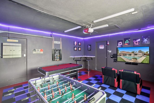 playroom featuring a textured ceiling