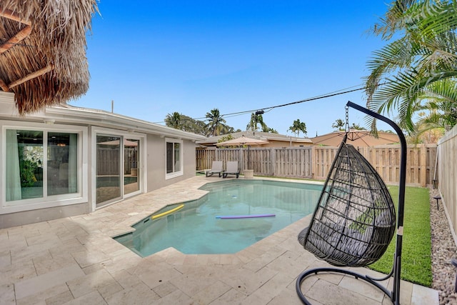 view of swimming pool with a patio area