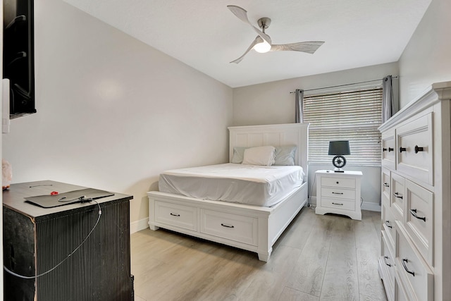 bedroom featuring ceiling fan and light hardwood / wood-style flooring