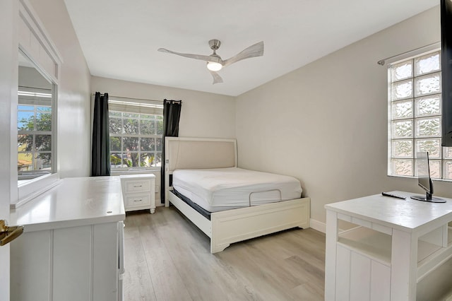 unfurnished bedroom featuring light hardwood / wood-style floors and ceiling fan