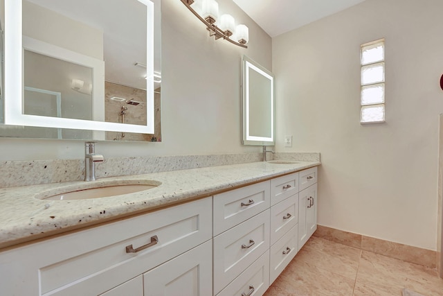 bathroom with tile patterned floors and double sink vanity