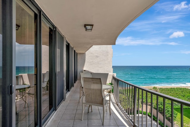 balcony featuring a water view