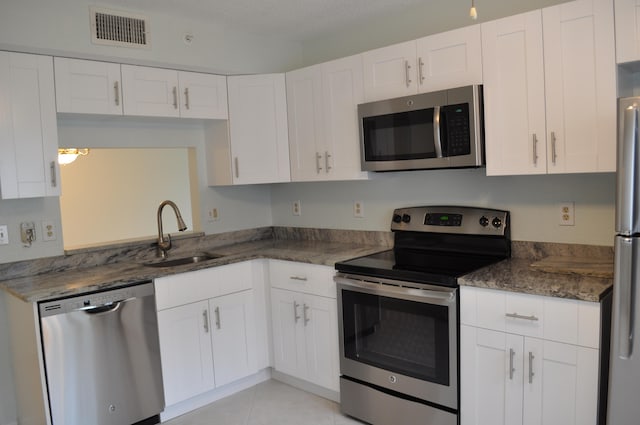 kitchen with white cabinets, sink, and stainless steel appliances