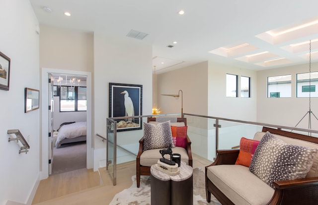 living area with light colored carpet and plenty of natural light