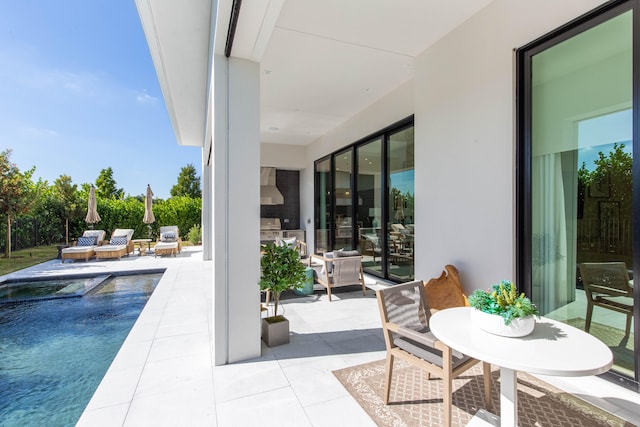 view of patio / terrace with an outdoor living space and a grill