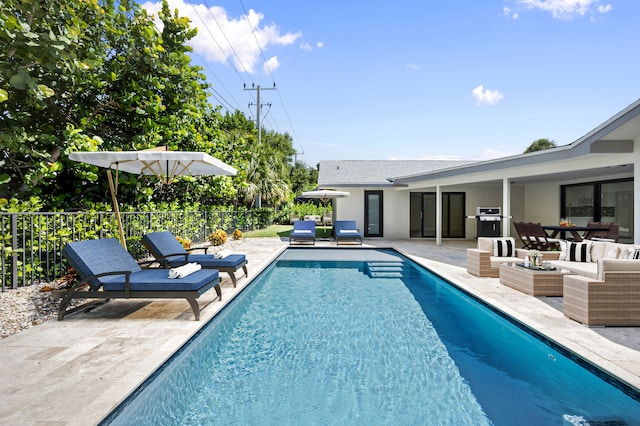 view of pool with a patio and an outdoor hangout area